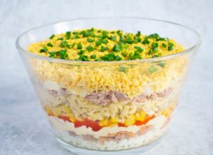 7 Layer Salad recipe: A salad that is sure to be a hit at your next event!